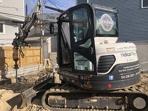 Helical pile installer
